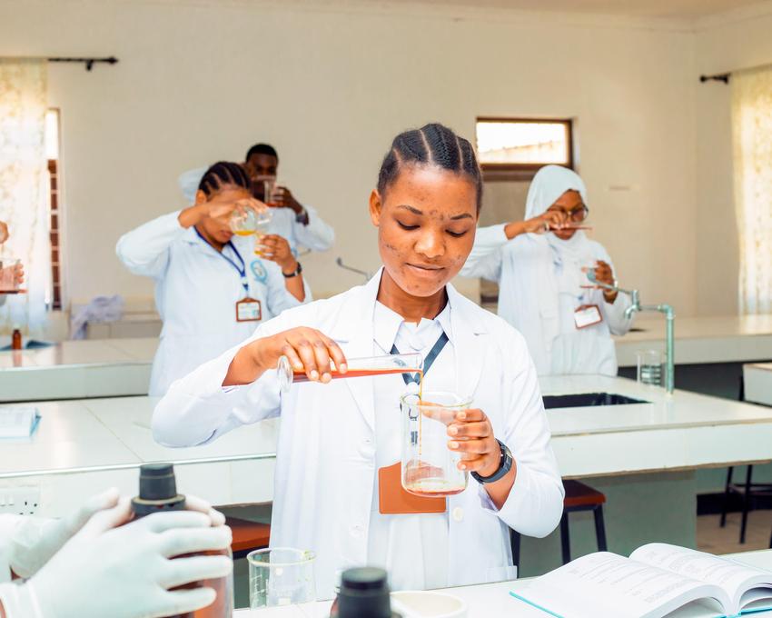 Compounding medicines in the pharmacy lab.